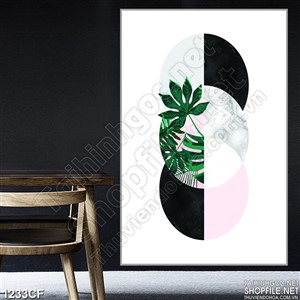 Tranh những hình tròn in lá xanh trên tường quán cà phê