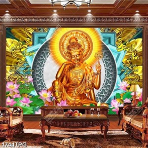 Tranh thư pháp kinh Phật và tượng Quan Âm mạ vàng