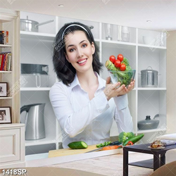 Tranh cô gái trẻ trung cầm bát rau xanh trong nhà bếp